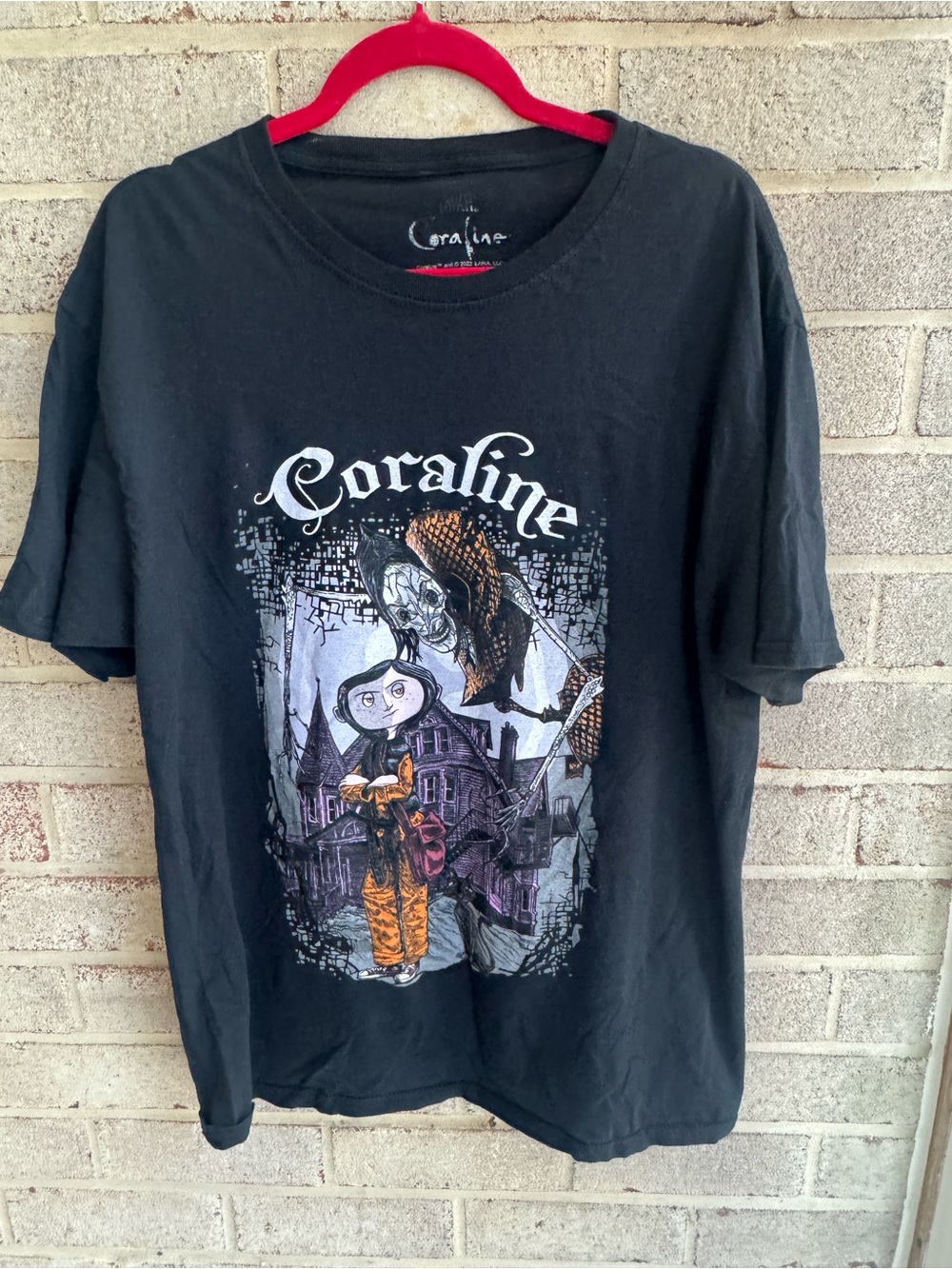 Coraline Black Graphic Tee with Purple & Orange Artwork
